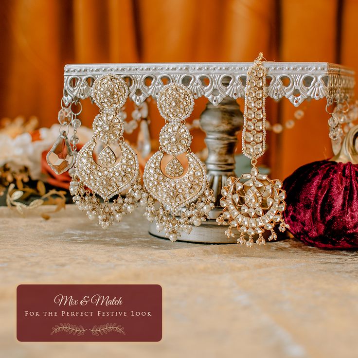 A statement of timeless elegance and glamorous sparkle! Classic and traditional style maang teekah handcrafted with kundan stones and pearl moti. Gold-plated on high-quality brass as base metal. In-stock & ready-to-ship. *Please Note: We use faux stones and beads in all of our jewelry. Elegant Chandbalis For Eid Ceremonies, Ceremonial Tikka With Intricate Design For Eid, Elegant Kundan Necklace With Mirror Work For Eid, Ceremonial Kundan Bridal Earrings With Stone Work, Kundan Bridal Earrings With Stone Work For Ceremonial Occasions, Elegant Ceremonial Jhumkas With Stone Work, Temple Jewelry Chandbalis With Stone Work For Eid, Festive Kundan Bridal Earrings For Ceremonial Occasions, Ceremonial Kundan Bridal Earrings With Intricate Design