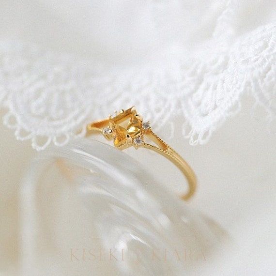 Kite Shape Citrine Dainty Gold Ring, Split Band Engagement Ring, November Birthstone Jewelry, Unique Crystal Rings, Citrine Rose Gold Ring DETAILS ♡⃛ ⃛ Main stone: Citrine Side stone: Moissanite Band width: 1.5mm Band thickness: 1.2mm OUR GEMSTONES ♡⃛ ⃛ At Kiseki Kiara, we use both precious and semi-precious stones throughout our jewelry designs, with each stone set-by-hand in our workshop. We carefully source gemstones for their quality and color ensuring you receive the best quality stones. Al Elegant Yellow Sapphire Ring For Wedding, Fine Jewelry Yellow Sapphire Rings With Diamond Accents, Elegant Citrine Crystal Ring With Gemstone, Elegant Citrine Crystal Promise Ring, Elegant Citrine Crystal Ring With Birthstone, Elegant Citrine Birthstone Ring For Formal Occasions, Elegant Citrine Birthstone Ring For Formal Events, Elegant Citrine Birthstone Crystal Ring, Elegant Citrine Crystal Ring