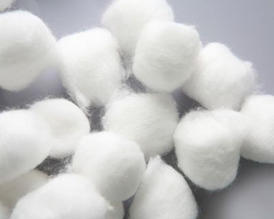 a pile of white cotton balls sitting next to each other