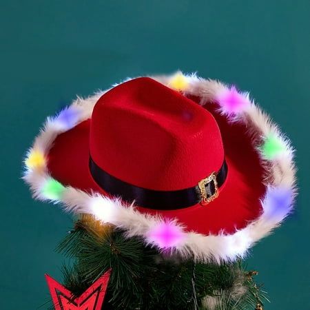 a red hat on top of a christmas tree