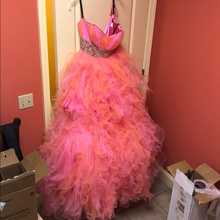 Pink Gown For Pageant During Prom Season, Pink Strapless Prom Gown, Pink Pageant Dress For Prom Season, Pink Dress For Prom Season Pageant, Pink Dress For Pageant And Prom Season, Pink Tulle Ball Gown For Evening, Pink Strapless Evening Dress With Ruffles, Pink Strapless Tulle Gown, Strapless Pink Gown For Debutante Ball