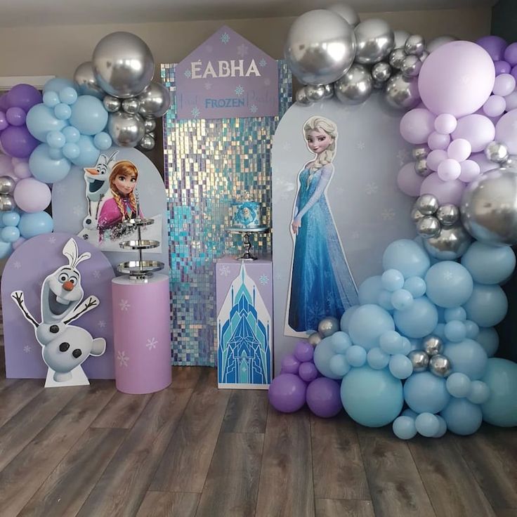 a frozen princess birthday party with balloons and decorations