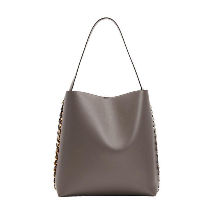 Stella McCartney tote bag in smooth shiny faux leather and fabric  Features two-tone chunky chain sides  Flat shoulder strap with engraved logo disc charm, 8.9" drop Open top with hook closure  Interior, one slip pocket Approx. 13.2"H x 11.8"W x 6.3"D Made in Italy Chic Rectangular Hobo Bag With Chain Strap, Elegant Hobo Bag With Chain Strap For Shopping, Modern Rectangular Bucket Bag With Branded Hardware, Shopping Shoulder Bucket Bag With Chain Strap, Everyday Bucket Bag With Chain, Shopping Bucket Bag With Chain Strap, Chic Chain Shoulder Bag For Shopping, Everyday Bags With Gold-tone Hardware And Chain Link Shape, Everyday Bags With Gold-tone Chain Link Hardware