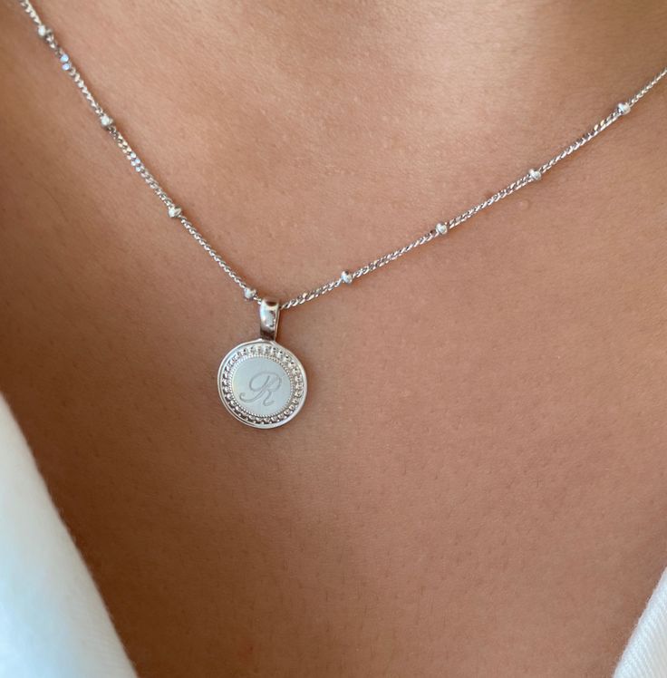 From our P.S. Collection, the P.S. Small Round Necklace is delicate frame of milgrain detail, with space for three custom engraved letters, like a cherished set of initials. Engraving is complimentary in your choice of font. Available with our suggested 18K Oval Link Chain or as a solo charm to curate into your everyday neck story. 18K Yellow Gold Charm 18K Yellow Gold Oval Link Chain Pendant Length: 10mm Chain length: 16" Luxury Initials Round Pendant Jewelry, Classic Oval Link Personalized Necklace, Elegant Silver Initials Jewelry, Elegant Silver Jewelry With Initials, Classic Polished Initial Pendant Jewelry, Classic Sterling Silver Initials Jewelry, Classic Sterling Silver Jewelry With Initials, Classic Round Pendant Jewelry With Initials, Luxury Silver Initials Necklace