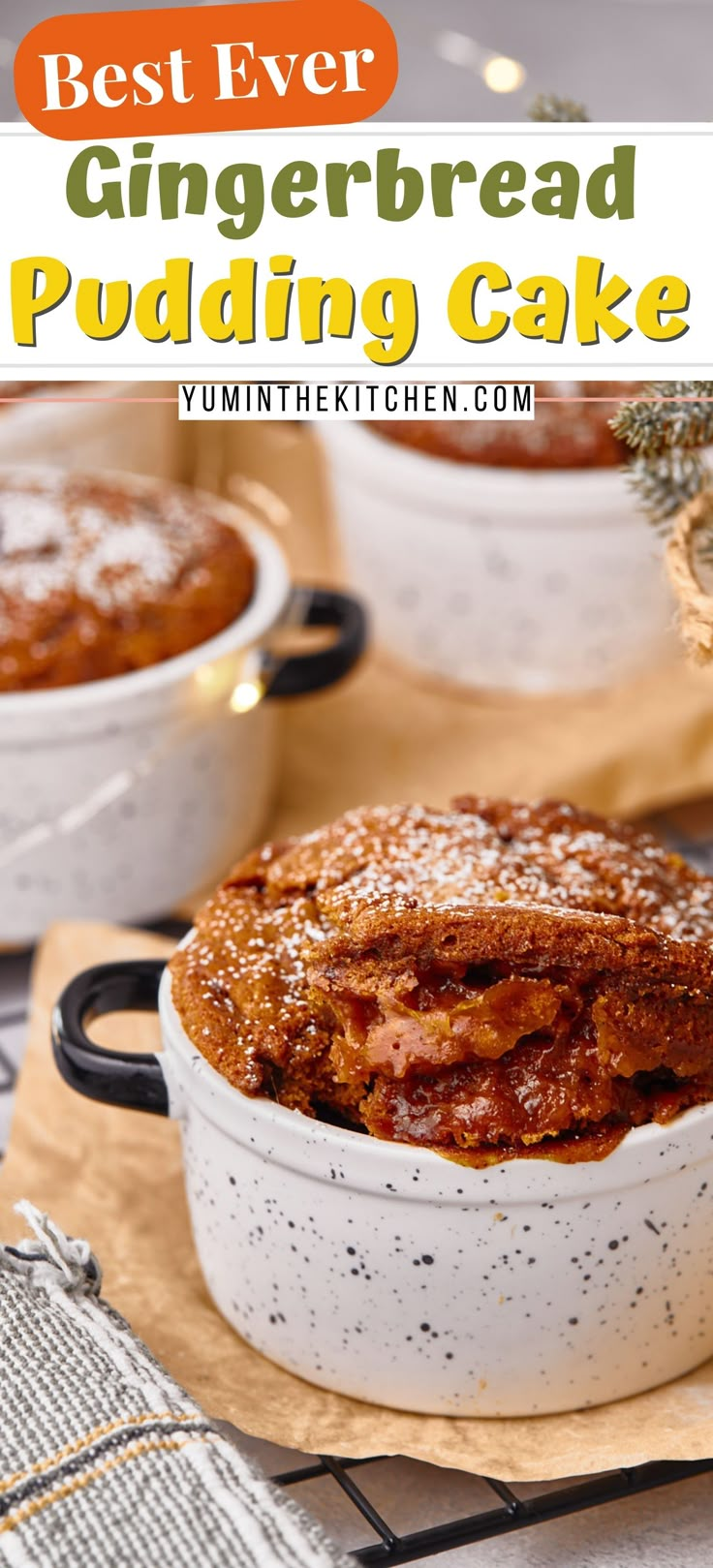 the best ever gingerbread pudding cake in a white dish with powdered sugar on top