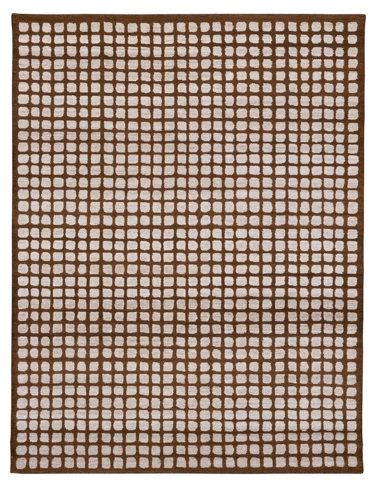 a brown and white rug with squares on it