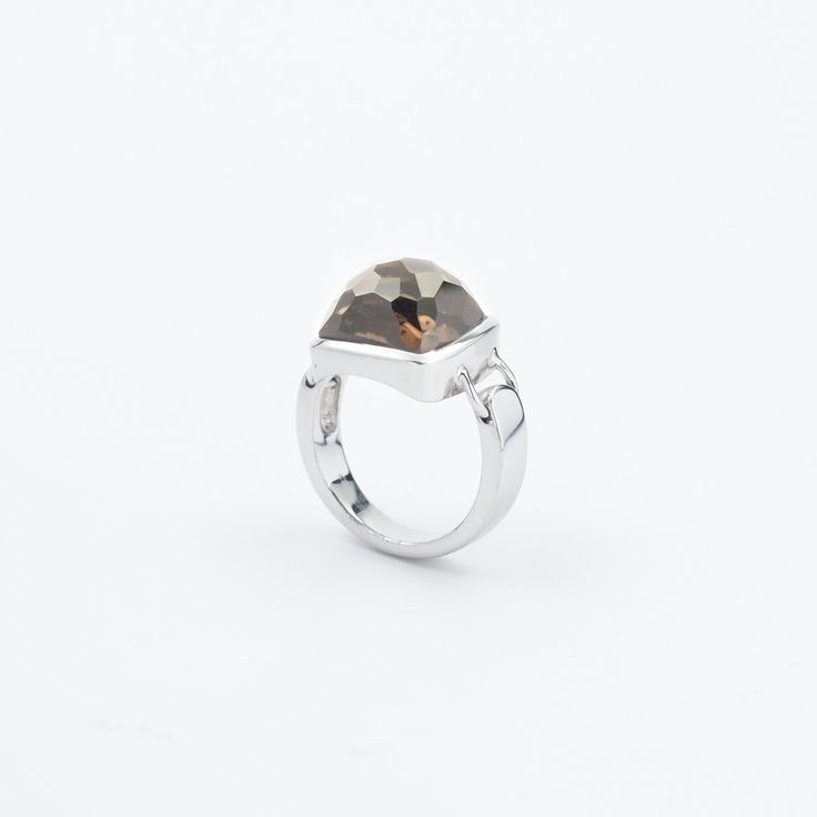 Embrace the timeless elegance of this stunning ring, featuring a faceted Smoky Quartz stone. The Smoky Quartz, with its unique cushion cut, boasts a mesmerizing play of light and shadow, creating an enchanting visual appeal. Set in a sleek, contemporary sterling silver band, the ring showcases clean lines and a modern design, making it a versatile piece for any jewelry collection. Whether for a special occasion or everyday wear, this ring is sure to add a touch of sophistication and mystery to y Modern Open Crystal Ring For Formal Occasions, Modern Crystal Ring With Polished Finish For Formal Events, Modern Crystal Ring With Polished Finish For Formal Occasions, Fine Jewelry Faceted Open Ring, Faceted Open Ring Fine Jewelry, Faceted Fine Jewelry Open Ring, Modern White Gold Crystal Ring With Gemstone, Modern Gemstone Stackable Rings For Formal Events, Modern Gemstone Stackable Rings For Formal Occasions