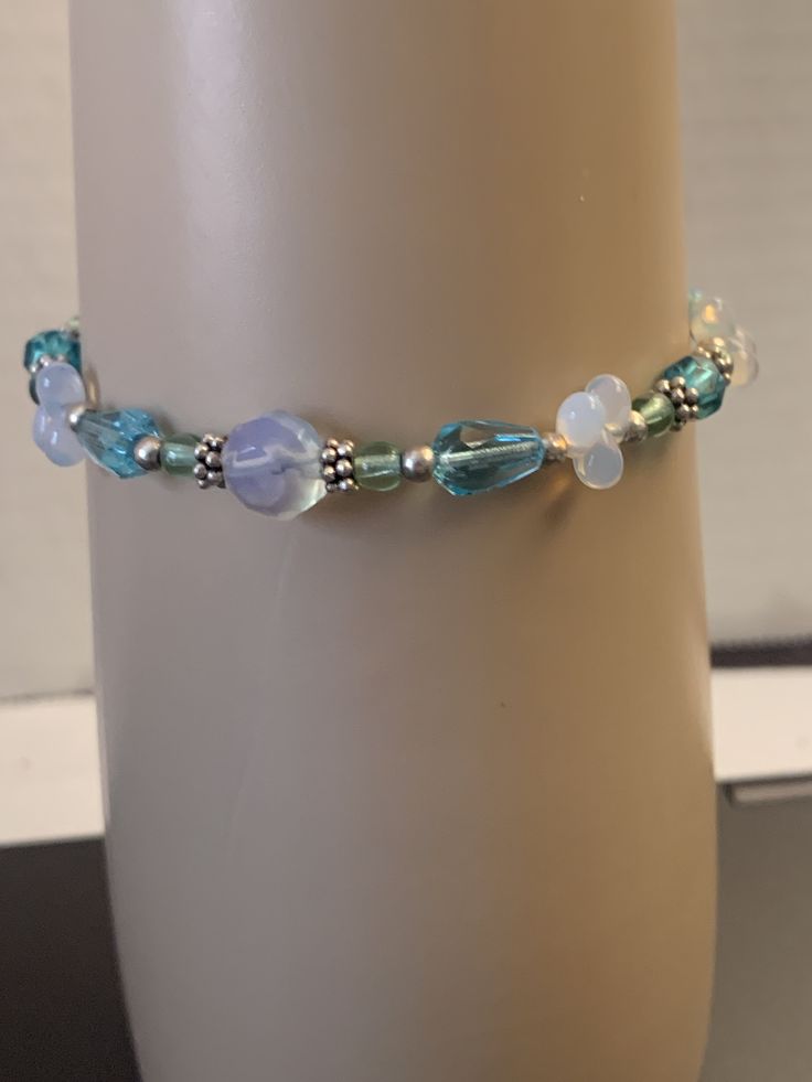 Austins designs blue beaded bracelet Handmade Light Blue Beaded Bracelets, Elegant Adjustable Blue Crystal Bracelet, Blue Crystal Bracelet With Spacer Beads, Elegant Blue Stretch Bracelet With Faceted Beads, Elegant Adjustable Blue Bracelets, Blue Stretch Bracelet With Polished Beads As Gift, Elegant Adjustable Blue Beaded Bracelets, Elegant Blue Bead Bracelet, Gift Blue Stretch Bracelet With Polished Beads