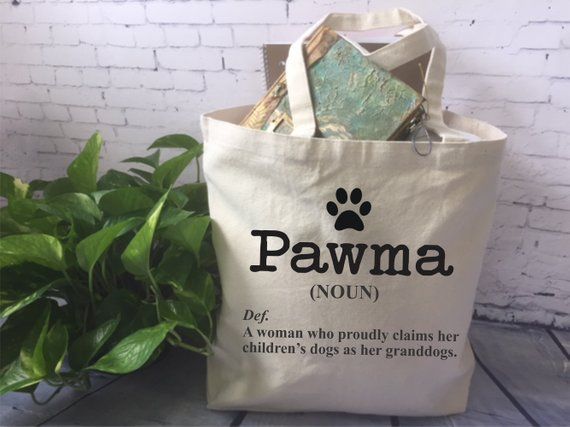 a bag that says pawma on it next to a potted plant