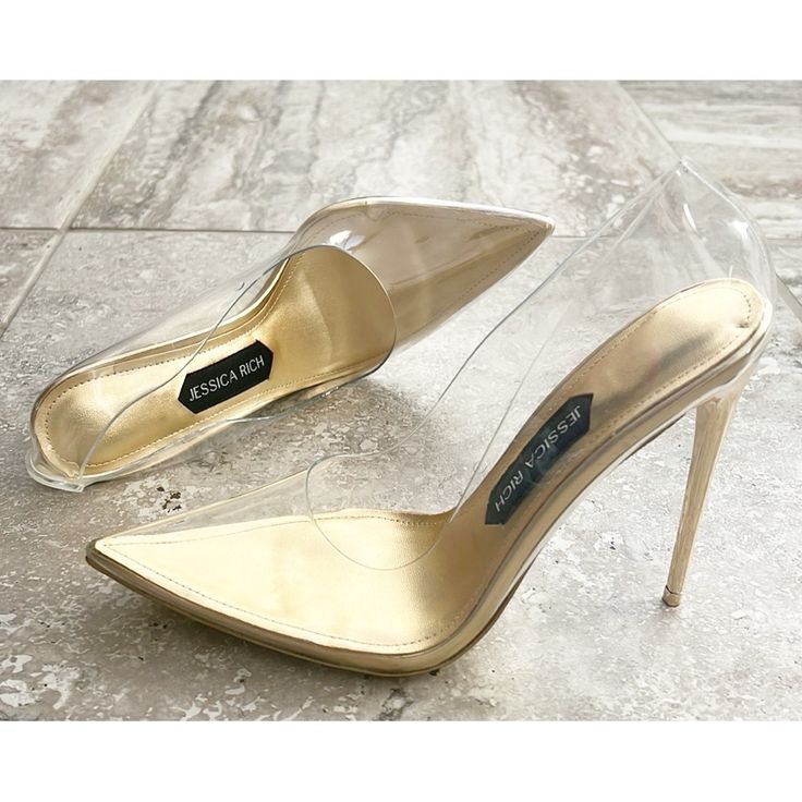 Jessica Rich Fancy Stiletto Clear Vinyl Pointed Toe Pumps Size 37, New In Box Pointed Toe Slip On Clear Upper Has Holes For Breathability 4.7" Heel Upper: Polyurethane; Lining: Leather; Sole: Leather Imported Clear Vinyl Pointed Toe Chic Gold Wedding Shoes With Padded Heel, Gold Court Shoes With Branded Heel Counter, Gold Court Shoes With Branded Heel, Chic Gold Wedding Shoes With Wrapped Heel, Classic Wedding Shoes With Sculpted Heel For Party, Chic Gold Open Toe Court Shoes, Gold Classic Heels For Party, Chic Gold Almond Toe Wedding Shoes, Chic Fitted Gold Wedding Shoes