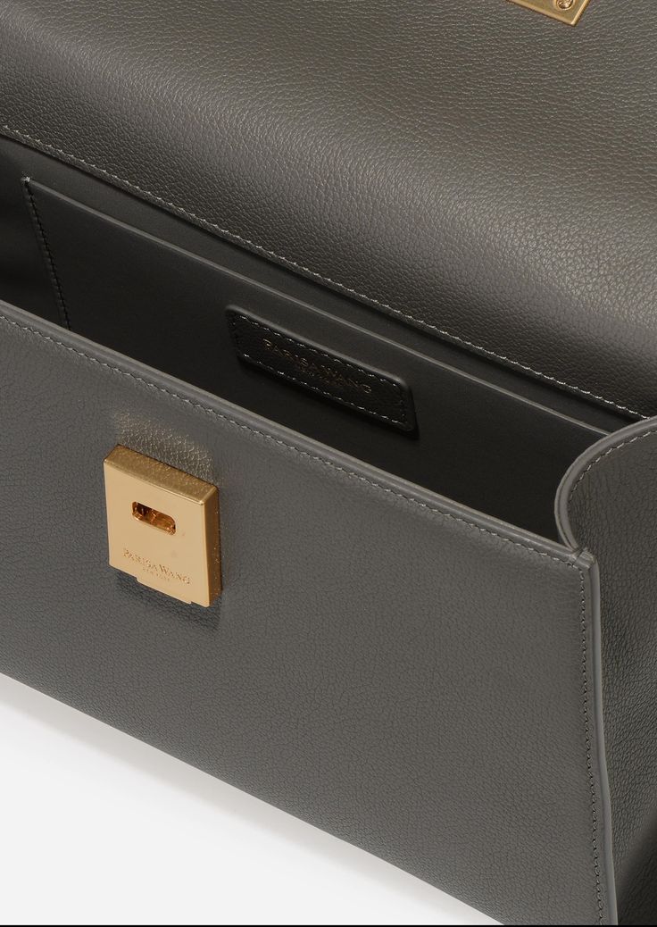 Inspired by Grace Kelly's enduring style, the Grace Top Handle Bag is meticulously crafted from premium USA full-grain textured calfskin leather, ensuring both durability and elegance. Its timeless and versatile design features a thoughtfully structured interior that comfortably accommodates all your everyday essentials. Whether day or night, you'll find yourself instinctively reaching for this chic and easy-to-wear masterpiece. Timeless Textured Leather Shoulder Bag For Office, High-end Textured Leather Shoulder Bag For Office, High-end Epsom Leather Shoulder Bag For Everyday Luxury, High-end Textured Leather Office Bags, Timeless Calf Leather Flap Bag For Everyday, Business Flap Bag With Textured Leather And Top Handle, Timeless Textured Calf Leather Shoulder Bag, Luxury Epsom Leather Rectangular Shoulder Bag, Textured Leather Top Handle Flap Bag