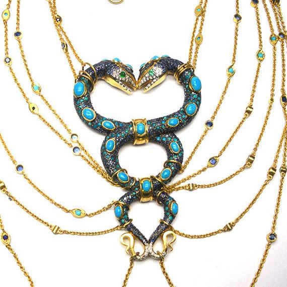 Stunning Diamond Sapphire Turquoise Snake Necklace Boucheron Inspired Red Carpet Worthy, Sits beautifully on the neck and Bust 14k Gold- 2 gms Rosecut Diamond- .75 Silver- 72.94 Turquoise- 12 carats Blue Sapphire- 9.5 carats Please note that it is very difficult to set up proper international shipping rates to each country. Please contact me and I will give you a direct quote for shipping and insurance charges to your country and will adjust accordingly as you will be charged for the ACTUAL ship Luxury Blue Jeweled Necklaces, Luxury Turquoise Pendant Necklace, Luxury Blue Jeweled Jewelry, Exquisite Turquoise Jewelry Gift, Exquisite Turquoise Jewelry As Gift, Exquisite Turquoise Jewelry For Gift, Luxury Turquoise Gemstone Necklace, Luxury Turquoise Pendant Jewelry, Luxury Turquoise Round Necklace