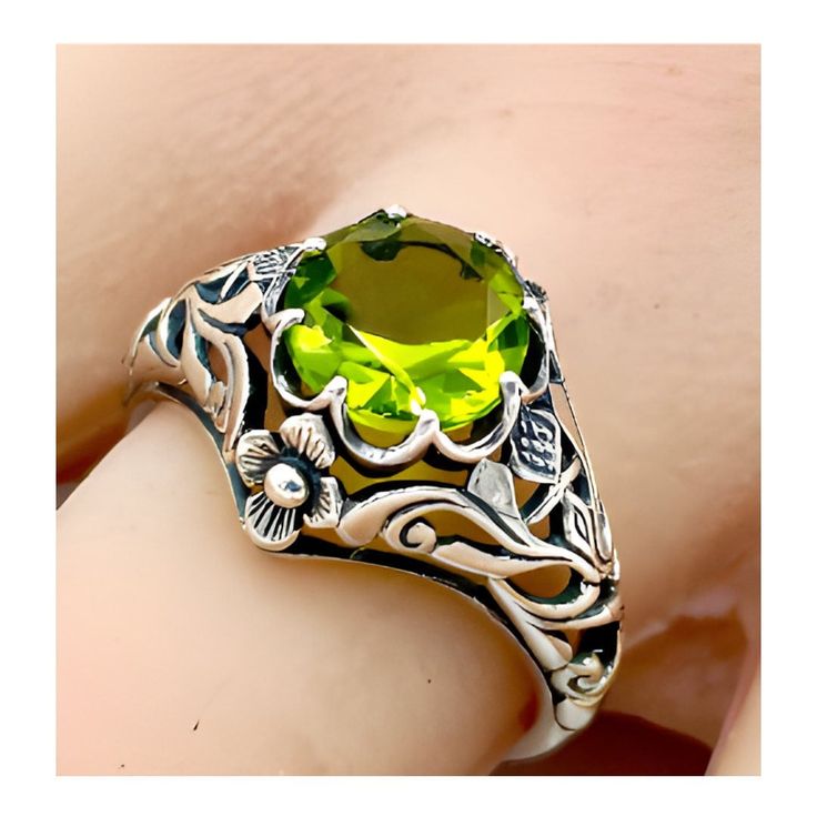 Vintage 1.50 Carat Simulated Peridot "SCOTTISH THISTLE" In 925 Solid Sterling Silver Solitaire Filigree Ring. Intricate Floral Details. The Top Of The Ring Measures 1/2 Inch In Length. Stamped 925.  Excellent Condition/Like New  Ring Sizes 5-12. Classic Silver Peridot Rings, Classic Silver Ring With Peridot, Green Filigree Ring For Anniversary, Victorian Green Engraved Ring, Green Sterling Silver Filigree Ring For Anniversary, Green Oval Filigree Ring In Sterling Silver, Vintage Peridot Ring For May Birthstone, Green Filigree Ring For May Birthstone, Classic Green Sterling Silver Filigree Ring