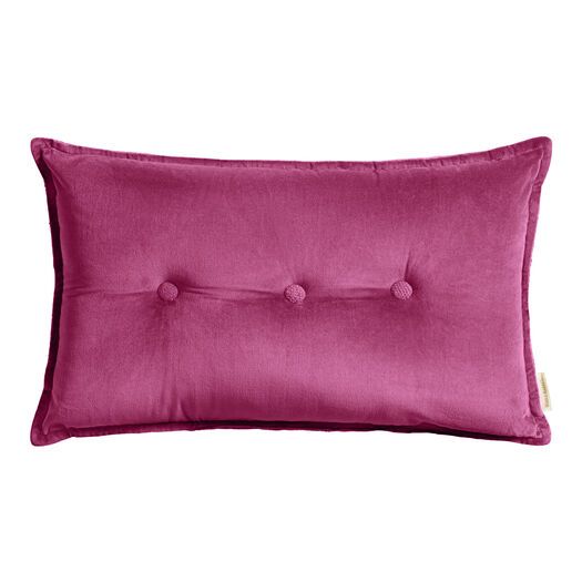 a pink pillow with buttons on the front and back, sitting against a white background