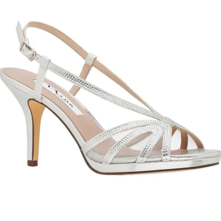 Purchased These For My Daughter’s Wedding But I Ended Up Wearing A Different Pair. Never Used. In Original Box. I Paid $49.50 In November 2022. Strappy Sandals For Spring Wedding, Strappy Wedding Sandals For Spring, Elegant Silver Strappy Sandals, Spring Wedding Strappy Heels, Synthetic Low Heel Sandals For Prom, Elegant Sandals With Heel Strap For Prom, Glamorous Synthetic Sandals For Wedding, Elegant Synthetic Sandals For Prom, White Strappy Wedding Sandals