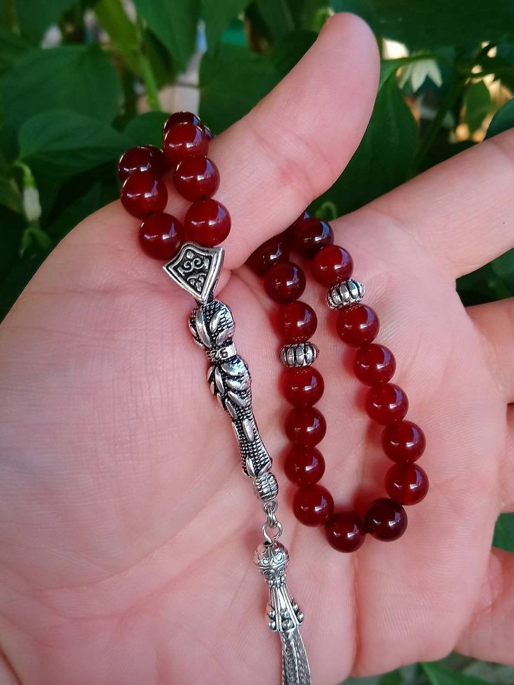 ✔️ This magnificent tasbih made with AA quality 8 mm carnelian agate beads. ✔️ It is a elegant and striking tesbih. ✔️ Natural Color ✔️ Natural Stone ✔️ Each order comes in a special box. ✔️ PLEASE CLICK THE LINK FOR ALL PRAYER BEADS MODELS https://www.etsy.com/shop/GoodJewelsofYazmasal Note: As a natural feature the stones beads may have some variations. SHIPPING: United States (Standart/DHL eCommerce/usps): 7-10 business days United States (Express/FedEx): 3-5 business days Canada (Express/Fed Red Gemstone Beads As Gift, Red Gemstone Beads For Gifts, Spiritual Red Beads, Gems, And Cabochons For Gifts, Red Carnelian Beads Gems And Cabochons For Gift, Red Carnelian Beads For Gift, Red Carnelian Beads For Gifts, Traditional Agate Beaded Bracelets Gift, Traditional Agate Beaded Bracelet Gift, Traditional Red 8mm Beads