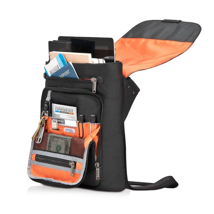 an orange and black bag filled with lots of items