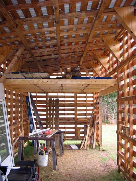 the inside of a wooden structure with lots of wood planks on top of it