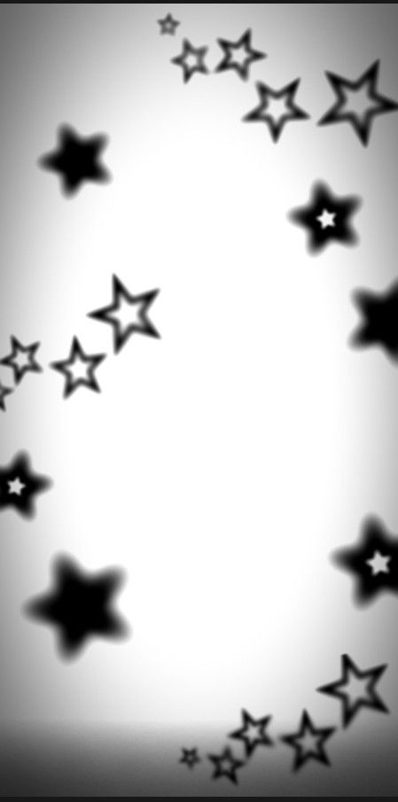 black and white stars are flying in the air