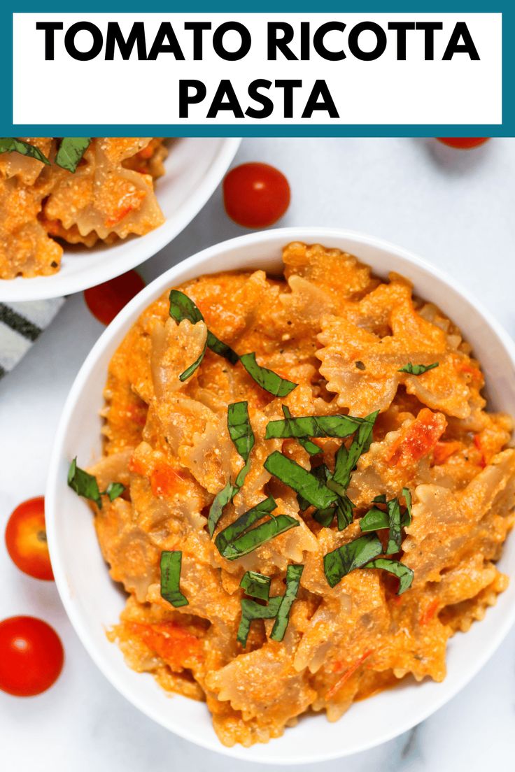 two white bowls filled with tomato ricotta pasta