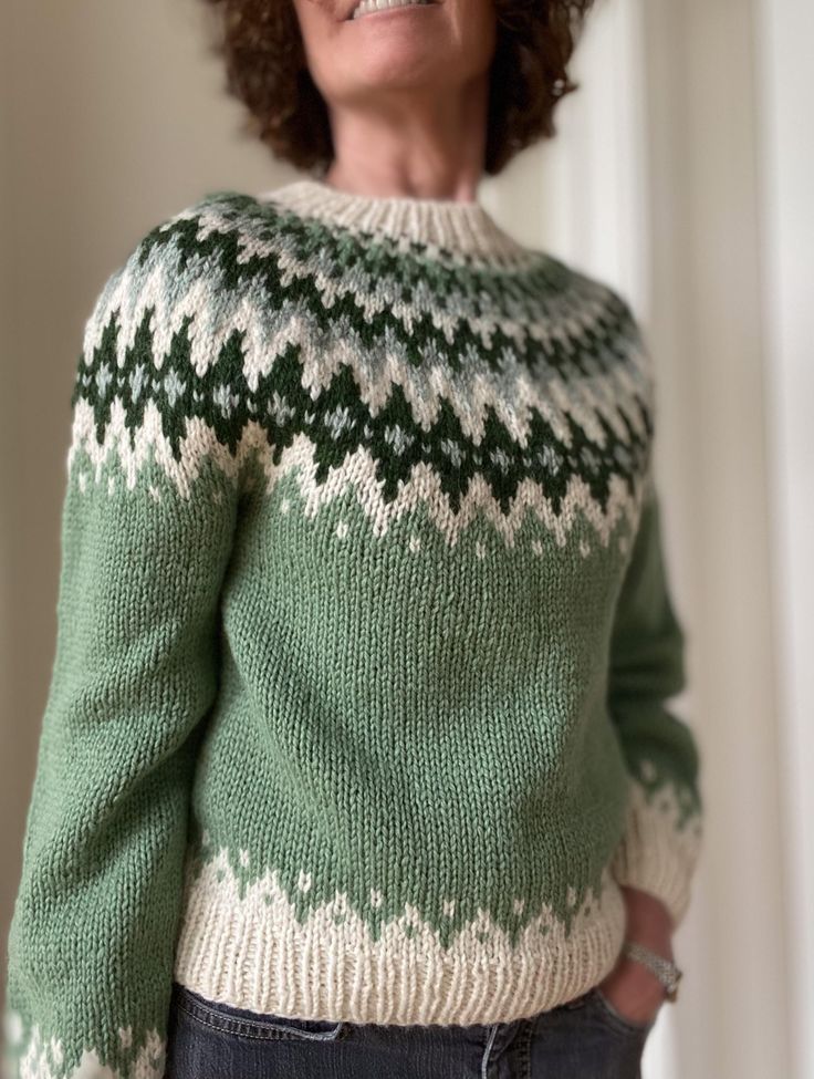 I have handknitted this Alevikki sweater with Norwegian high quality 100% wool Vams by Rauma. The size is Small. Length from neck: 52 cm/20.47 in Width around body: 90 cm/35.43 in Sleeve length from armpit: 44 cm/17.32 in Compare the measurements with one of your favourite sweaters. If the sweater looks perfect on you, I am the happiest The wool is self-rinsing so you rarely need to wash it. If so, handwash in cold to handwarm water, max. 30 degrees Celsius, and dry flat.  REMEMBER that the imag Scandinavian Hand Knitted Crew Neck Sweater, Cozy Green Fair Isle Sweater, Hand Knitted Nordic Long Sleeve Knitting Pattern, Nordic Hand Knitted Long Sleeve Knitting Pattern, Nordic Knitted Crew Neck Sweater, Nordic Long Sleeve Hand Knitted Pattern, Nordic Crew Neck Knitted Sweater, Nordic Hand Knitted Wool Sweater, Nordic Wool Sweater Hand Knitted