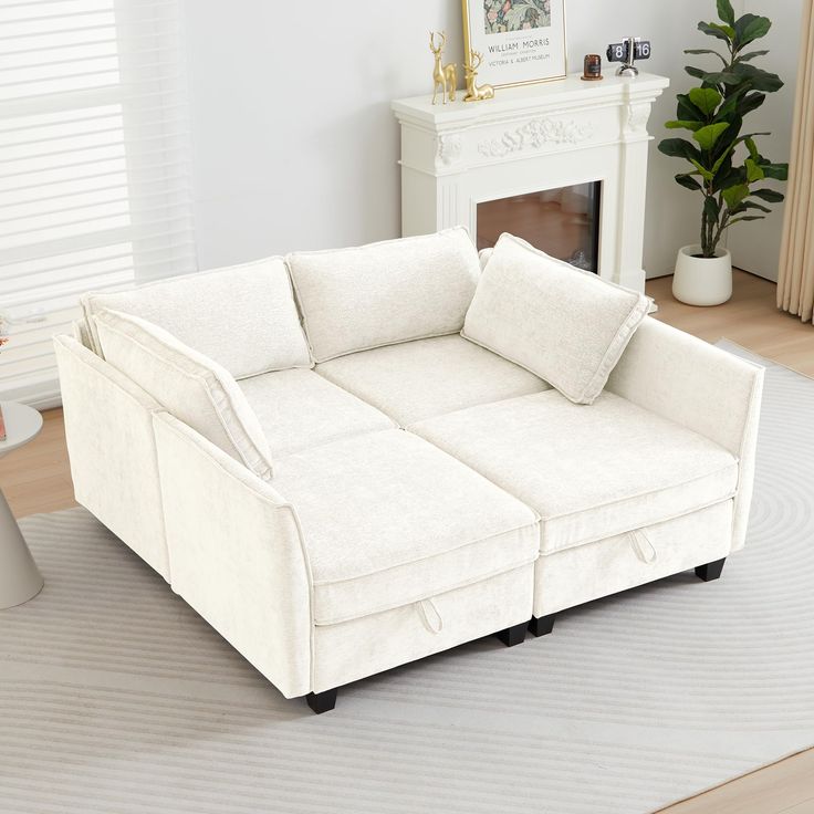 a white couch sitting on top of a hard wood floor