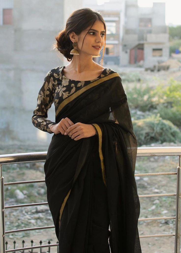 Includes: Blouse Saree Fabric: Blouse: Jamawar Saree: Loom Net Work Technique: Embroidery Description: *Complete stitched 8 yards saree *pleats are stitched too *Tassel on the back *Round neck *Titch button sleeves Disclaimer: The color of the outfit may vary due to the lighting effect used in the photography. Black Saree Blouse, Blouse Inspiration, Sarees For Girls, Saree Wearing Styles, Simple Saree Designs, Fashionable Saree Blouse Designs, Fancy Sarees Party Wear, Saree Poses, And So It Begins