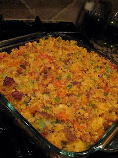 a casserole dish with vegetables and meat in it on the stove top, ready to be eaten