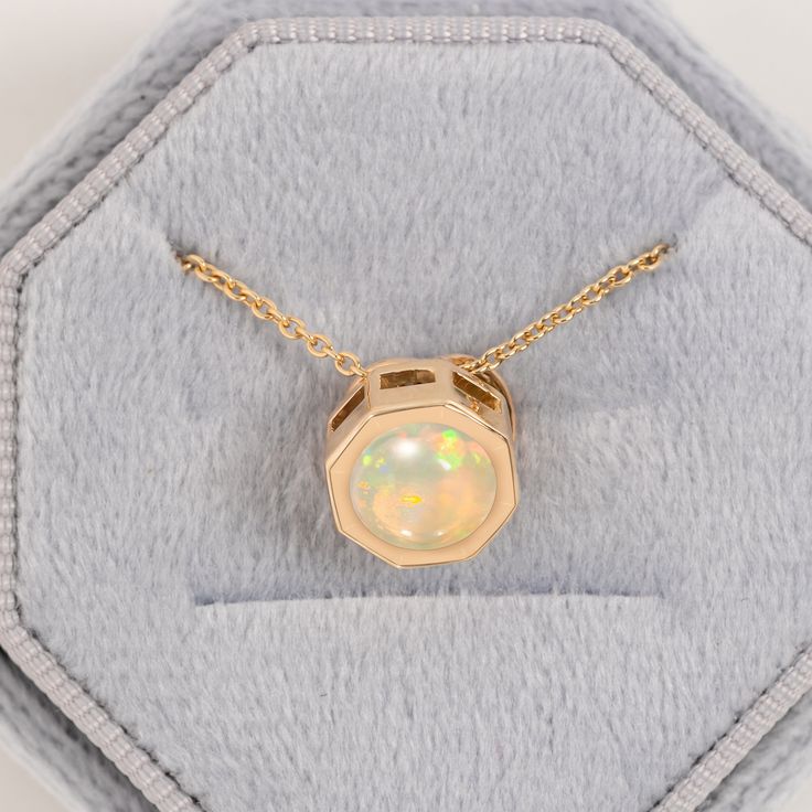 Looking for the perfect engagement gift? The Ethiopian Opal Pendant, with its minimalist style, is the perfect engagement pendant. made of 14/18k solid gold, statement jewelry for women. octagon-shaped natural opal pendant ideal for brides-to-be. an anniversary gift or a cherished present for a beloved daughter  Ethiopian Opal Pendant, 14/18k Solid Gold, Floating Pendant, Unique Round Opal Necklace, Wedding Gift for Bride, Minimalist Necklace for Her ★ ★ CUSTOM/DUTY-FREE SHIPPING WORLDWIDE, BUYE Minimalist Yellow Gold Solitaire Necklace, Minimalist 14k Gold Solitaire Pendant Necklace, Modern Necklace With Diamond Cut For Gifts, Minimalist 14k Gold Solitaire Necklace With Round Pendant, Minimalist 14k Gold Solitaire Round Pendant Necklace, Modern Necklaces With Diamond Cut For Gifts, Modern Diamond Cut Necklace As A Gift, Minimalist Solitaire Pendant Necklace, Minimalist Gold Solitaire Necklace With Round Stone