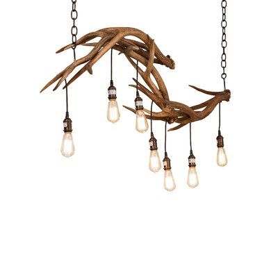 a chandelier made out of driftwood with light bulbs hanging from the ceiling