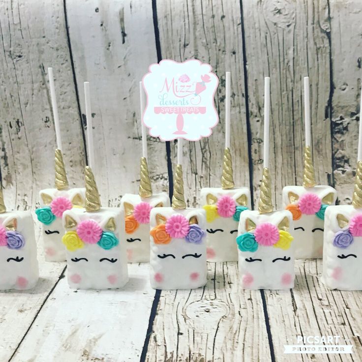 unicorn cake pops are decorated with colorful flowers