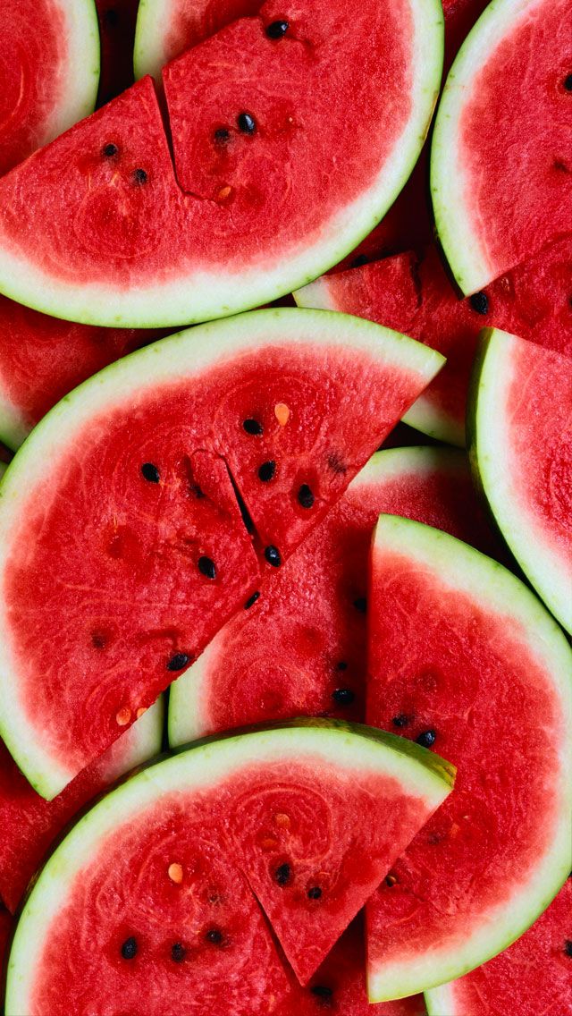 slices of watermelon on a red cutting board