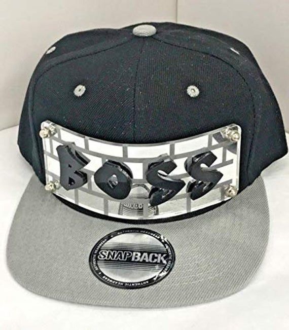 "Personalized Custom Snapback Hat Six Panel Flat Bill Snap Back Hat Cap with Laser Cut Graffiti Letters, Custom Made to Order, Comfortable and Unique, Great Gift, an Exclusive Creation The snapback is new with tags, high quality, unique, and #1 Hear Wear. Great Personalized Gift - It's a \"Everything\" gift and great for birthdays, holidays, graduation, parties, everyday wear, special occassions, etc. The hat is a quality hat that is well made and has good stitching. We can make any name or word Custom Logo Snapback Hat With Flat Bill, Trendy Adjustable Snapback Fitted Hat, Trendy Adjustable Visor Snapback Hat, Trendy Gray Snapback Hat, Hip Hop Style Adjustable Visor Hat, Adjustable Hip Hop Visor Hat, Casual Silver Snapback Hat, Silver Casual Snapback Hat, Casual Silver Hat, One Size Fits Most