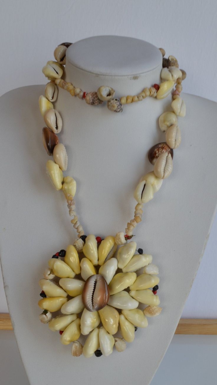 Massive vintage one of a kind handmade Papua New Guinea tiger shell & yellow Money Cowrie shell & other rare shells statement necklace with huge rosette flower pendant - no clasp  good condition 31 inches inner size; pendant: 4 inches diameter Thank you for watching my other items! similar items are listed and much more to come! Combined shipping available where possible -please contact us for details before buying the items. Unique Shell-shaped Mother Of Pearl Jewelry, Unique Mother Of Pearl Shell Jewelry, Handmade Mother Of Pearl Shell Necklaces, Handmade Shell Pendant Necklace, Unique Handmade Shell Pendant Necklace, Handmade Mother Of Pearl Shell Pendant, Unique Shell Necklace For Gift, Unique Shell-shaped Shell Necklaces, Traditional Shell Jewelry Gift