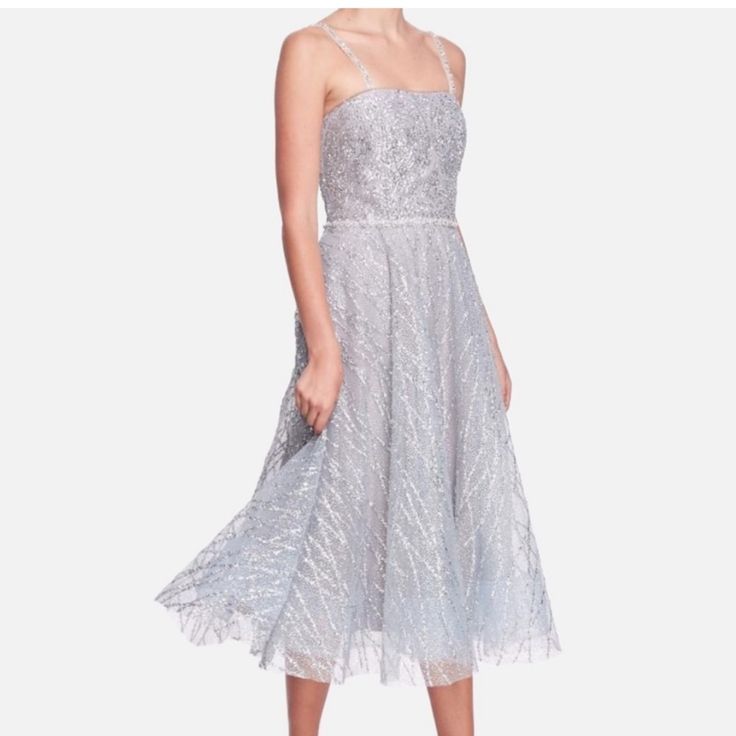 Nwt Color Is Bright Silver Glitter Marchesa A-Line Dress Silver Beaded, Sequin & Crystal Accents Sleeveless With Square Neckline Concealed Zip Closure At Back 100% Polyester Retails $795 Y2k, Summer, Spring, Striped, Retro, 60s, 70s, 80s, 90s, Boho, Bohemian, Lightweight, Airy, Breezy, Date, Brunch, Hollywood, Celebrity, Melrose, Sustainable, Eco-Conscious, Eco-Friendly, Fitted, A-Line, Fit & Flare Spring, Retro, Midi, Thigh Split, Velvet, Stretch, Flattering, Feminine, Flirty, Fitted, Curvy, Du Sleeveless Sequin Glitter Wedding Dress, Embellished Sleeveless Sequin Tulle Dress, Sleeveless Embellished Sequin Tulle Dress, Sleeveless Tulle Sequin Dress For Party Season, Sleeveless Sequin Tulle Dress For Party Season, Sleeveless Glitter Dress For Wedding, Sleeveless Glitter Wedding Dress, Elegant A-line Sequin Dress For Evening, Sleeveless Glitter Evening Dress For Wedding