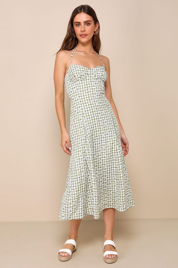 Looking absolutely darling is what the Lulus Daytime Sweetie Green Gingham Embroidered Halter Midi Dress is all about! Lightweight woven fabric boasts a green and white plaid pattern and delicate floral eyelet embroidery throughout as it shapes a sleeveless, sweetheart bodice with seamed cups and slender straps that create a tying halter neckline. The figure-skimming silhouette falls to an A-line midi skirt that features godet details that create a subtle flaring effect. A smocked panel at the b Spring Plaid Midi Dress Knee-length, Gingham Midi Sundress For Picnic, Gingham Sundress For Picnic, Plaid Square Neck Dress For Garden Party, Square Neck Plaid Dress For Garden Party, Spring Gingham Sundress For Brunch, Summer Plaid Midi Dress For Picnic, Summer Midi Length Plaid Picnic Dress, Summer Midi Length Plaid Dress For Picnic