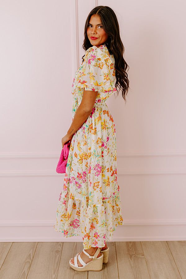 - Drape yourself in petals and twirl in the sun with this airy dress! - Chiffon material with a colorful abstract floral print - A built-in lining that ends above the ruffled hemline - A ruffled v-cut neckline with a tie detail - Short, loose ruffled sleeves - Pleated detail at the bodice - An elastic waistline - A flowy yet flattering silhouette that ends in a ruffled maxi length hemline Flowy Multicolor Midi Dress With Ruffles, Tiered Chiffon Floral Dress With Floral Print, Multicolor Chiffon Floral Dress For Garden Party, Multicolor Floral Print Chiffon Midi Dress, Multicolor Floral Chiffon Midi Dress, White Chiffon Floral Beach Dress, Flowy Multicolor Dress With Ruffle Hem, White Midi Dress With Ruffle Hem For Garden Party, Chiffon Multicolor Floral Print Midi Dress