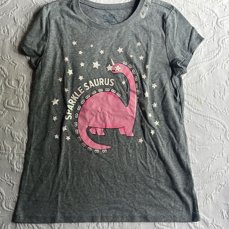 New With Tags Large 10 -12 Gray T Shirt With Pink Dinosaur, Glitter Letters And Stars Great For The Summer Or Hot Weather Bundle And Save I Ship Next Day Except On Weekends. Pink Dinosaur Print Crew Neck Top, Pink Dinosaur Print Short Sleeve Top, Pink Crew Neck Top With Dinosaur Print, Boys Basketball Shorts, Dino Shirt, Pink Dinosaur, Casual Activewear, Girls Art, Glitter Letters