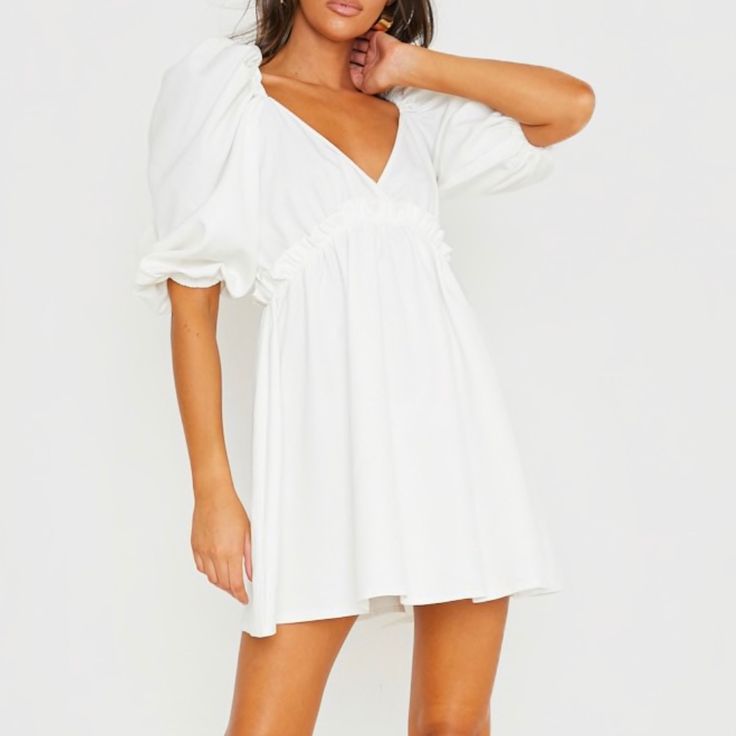 Collab Between In The Style And Lorna Luxe - Sold Out White A-line Ruched Mini Dress, White Puff Sleeve Ruched Dress, White V-neck Puff Sleeve Dress For Summer, White Ruched Puff Sleeve Dress, Ruched V-neck Sundress Mini Dress, Ruched V-neck Sundress, V-neck Puff Sleeve Ruched Dress For Day Out, White Flowy V-neck Dress For Brunch, Flowy White V-neck Dress For Brunch