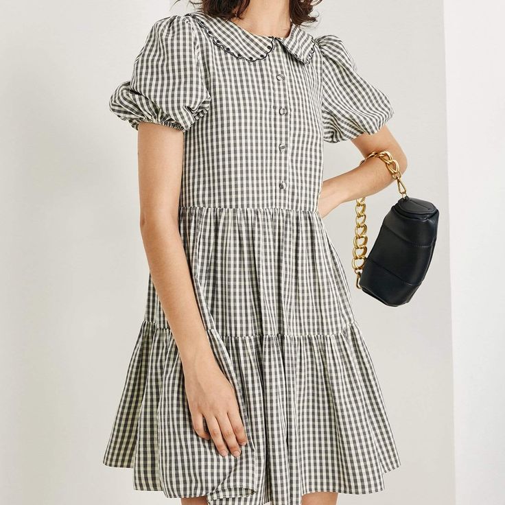 Feel classic in this 60s mini dress that was made for summertime picnics. Available in green, blue, and grey plaid, pair with sandals or white sneakers! No Stretch Medium Weight Regular Fit Fabric: 70% Polyester, 30% Cotton, Lining: 100% Polyester. Model is 177cm/5'9" tall, 79cm/31" bust, 58cm/23" waist and 88cm/35" hip and wearsa size S Care Instruction: Hand Wash, Do not bleach, Line dry in shade, Iron cool (max 110℃), Dry clean, tetrachloroethylene(PCE) only. Preppy Mini Dress For Summer, Preppy Knee-length Summer Dresses, Casual Summer Mini Dress For Picnic, Fitted Plaid Dress For Spring Picnic, Cotton Mini Dress For Picnic, Summer Gingham Mini Dress With Short Sleeves, Plaid Mini Dress For Summer, Spring Preppy Knee-length Dress, Trendy Gingham Dress For Summer