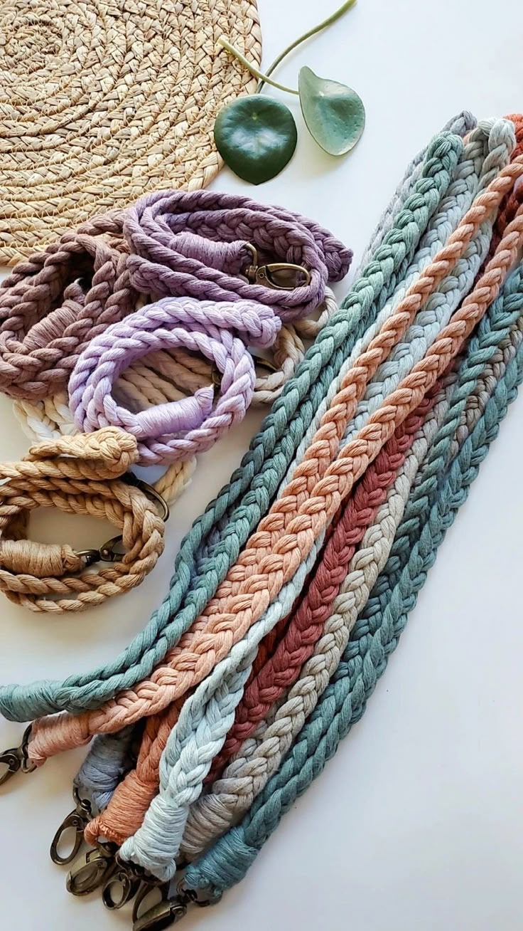 several different colored rope bracelets laying on top of each other