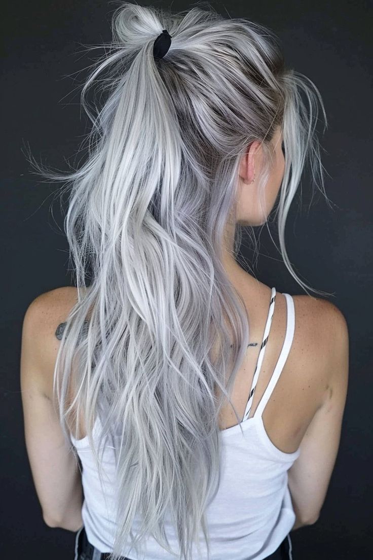 From the cute flowy silver ponytail you see here to messy updos and long loose waves, there are a ton of beautiful hairstyles for silver hair. Click through for 40+ hottest silver hair ideas and save your favorites! Silver Hair With Curtain Bangs, Silver Tipped Hair, Blonde Silver Hair Color Ideas, Silver Blonde Hair Color Ideas, Bright Silver Hair, Bright White Hair, Light Colored Hair Ideas, Platinum Blonde Hair With Roots, Gray Blonde Hair Color