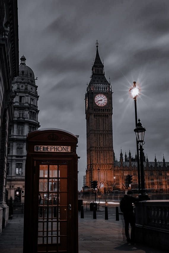 the big ben clock tower towering over the city of london, england at night time