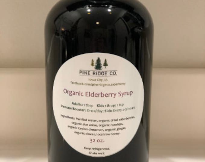 a bottle of organic elderberry syrup sitting on a counter