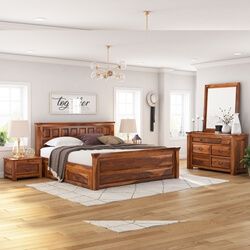 a bedroom scene with focus on the bed and dresser