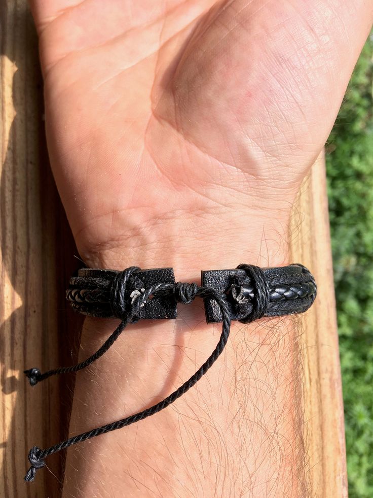 Black Leather Bracelet for men, Men's Jewelry Gift, Handmade leather Bracelet O4M-B08 Sign-up now for our Newsletter and receive a 10% Discount on your first order! https://mailchi.mp/7f649f87eb6c/only4men-newsletter This is a beautiful piece of jewelry, a unique and original Gift for Him! The Black Bracelet length is about 8 inches. This will fit most wrist sizes, but please make sure before you order this will fit your wrist size. The closure system is a Lanyard type, very easy to put on and t Black Leather Casual Wristband, Casual Black Leather Wristband, Black Leather Wristband For Father's Day, Handmade Black Leather Braided Bracelet, Father's Day Black Leather Jewelry, Durable Black Wristband Gift, Adjustable Black Leather Braided Bracelet, Black Leather Bracelet For Father's Day, Rectangular Leather Bracelet As A Gift