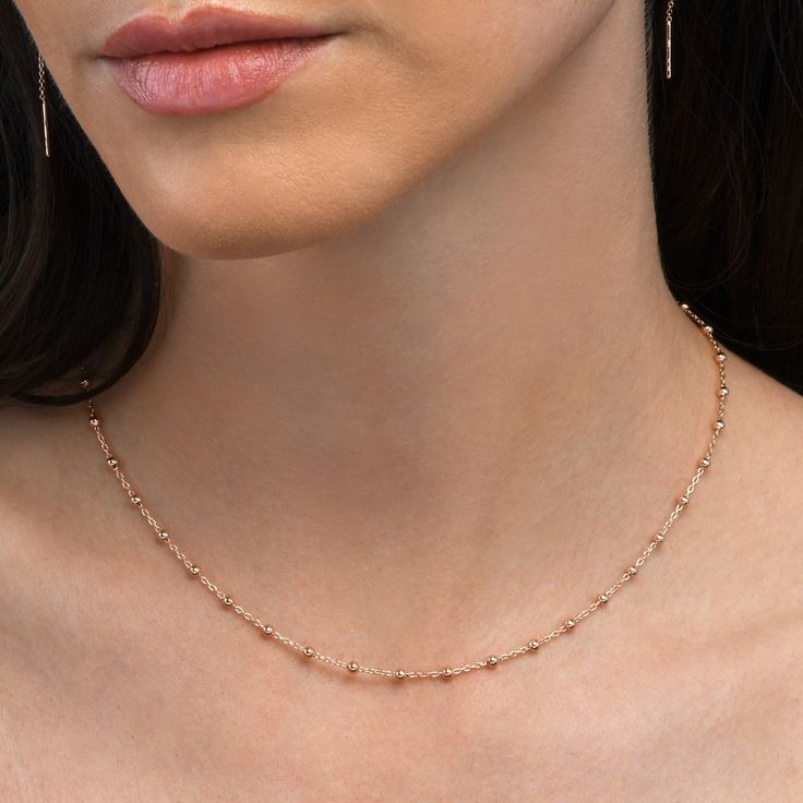 Features * Dainty beaded chain necklaces for women. A stylish satellite chain necklace with interspaced beads. * 16-inch long chains with a 2-inch extension. Cute cable chain necklace with 2.5mm small balls spaced by an 8mm interval * Rose gold chain necklaces for women and teenage girls made from 18ct rose gold plated 925 Sterling Silver * Elegant chain necklaces by Namana. High-quality rose gold-plated 925 sterling silver jewellery for women. * Stylish dainty chain necklaces for women presente Rose Gold Chain Women, Office Wear Jewellery, Silver Chain Necklace For Women, Minimalist Accessories Jewellery, Gold Ball Chain, Gold Chain Necklaces, Rose Gold Chain Necklace, Dainty Chain Necklace, Rose Gold Pendant Necklace