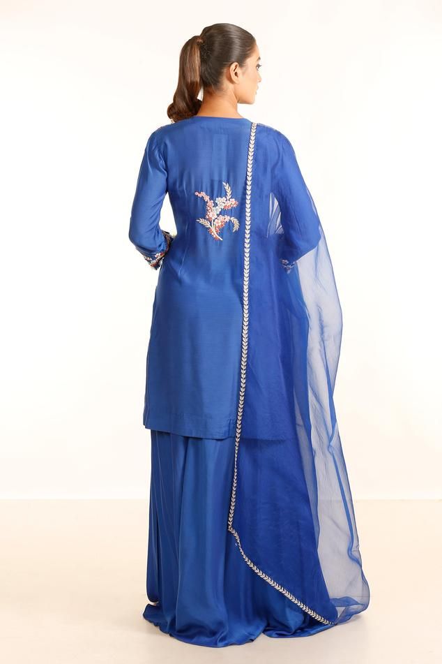 Electric blue kurta with placement embroidery in floral pattern. Paired with a palazzo and dupatta.
Components: 3
Pattern: Embroidery
Type Of Work: Floral
Neckline: Tear Drop Neck
Sleeve Type: Full Sleeves
Fabric: Silk Muslin And Organza 
Color: Blue
Other Details: 
Length:
Kurta: 38 inches
Palazzo: 40 inches
Closure: Side zip
Occasion: Sangeet - Aza Fashions Placement Embroidery, Kurta Palazzo Set, Organza Embroidery, Blue Kurta, Palazzo Set, Embroidery Floral, Pattern Embroidery, Fabric Silk, Blue Silk