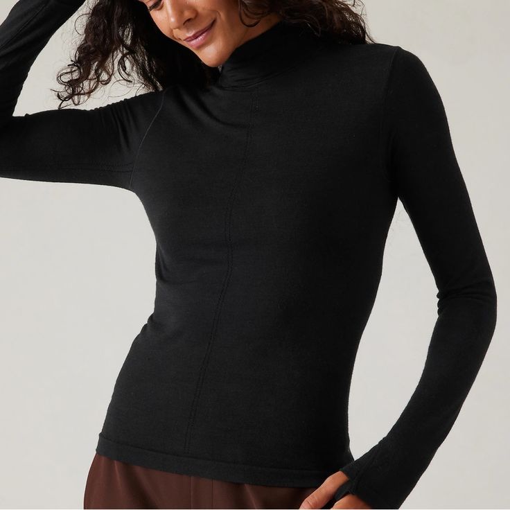 Athleta Ascent Seamless Turtleneck. Size Small. New With Tags. For: Commute, Travel, Hiking In Cold Weather Climates Feel: New And Improved Merino Wool Yarn Is Ultra-Soft, Lightweight, And Resists Pilling Fave: Pointelle Stitching Down The Front For Breathability Close-To-Body Fit Make It The Perfect Base Layer Light Mesh Structure On Back Facilitates Ventilation Wool/Nylon Seamless: Beyond-Soft, Chafe-Free Fabric Stretches With Every Move Breathable: Airflow Moves Easily Through The Garment Machine Wash And Lay Flat To Dry. Fitted Next To The Body Regular Length, Hits At Low Hip T-Neck Body Length In Size Medium: Regular: 22" Black Seamless Tops For Pilates, Seamless Black Tops For Pilates, Athleisure Tops For Pilates With Snug Fit, Athleisure Snug Fit Tops For Pilates, Seamless Fitted Activewear For Layering, Functional Stretch Tops For Layering, High Neck Athleisure Activewear For Gym, Black Compressive Seamless Top, Black Tops For Pilates With Seamless Construction