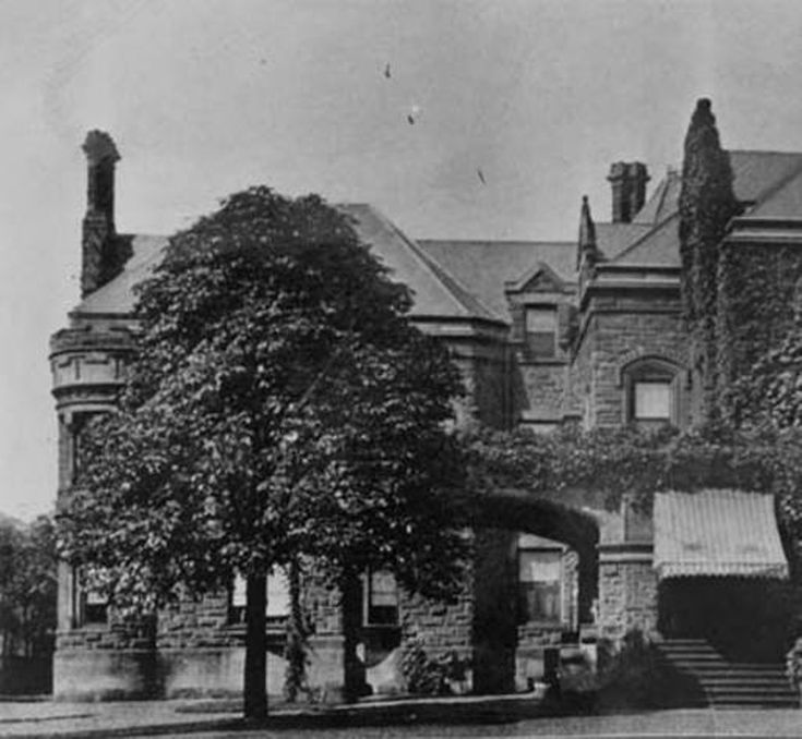 an old black and white photo of a large building